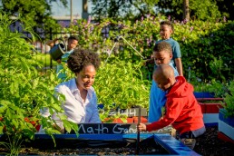 Kira Orange Jones in learning garden with kids